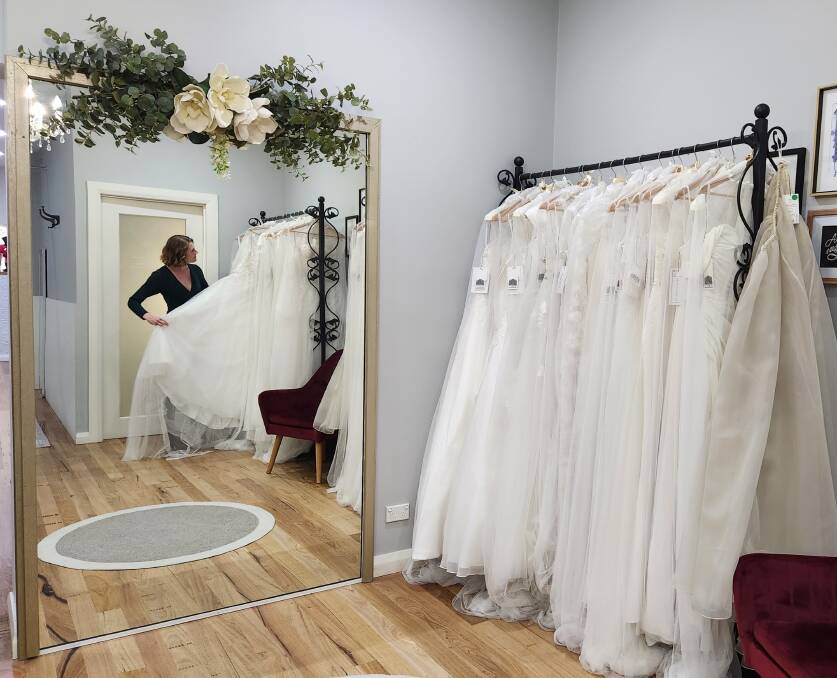 Carla Ellwood with the latest collection of bridal dresses at CC Bridal's new store in Bega. Picture by Amandine Ahrens. 