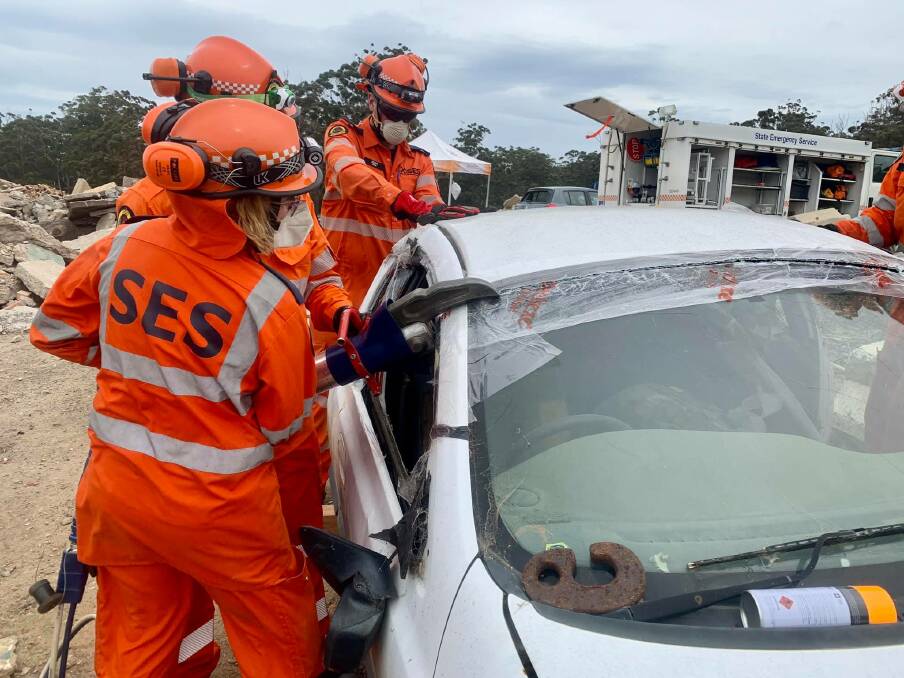 SES volunteers practise their skills of cutting and opening up a car in the event of a crash when a trapped person needs to be rescued, January 2021. Picture supplied