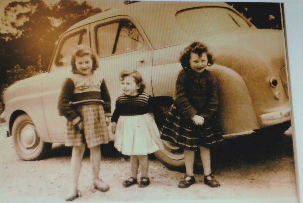 The McKenna girls - Shirley (Rixon) with her sisters Julianne and Marjorie outside the Old Kiah Hall. Picture supplied. 