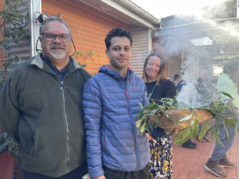 Uncle David Dixon, Marcus Mundy and Sam Avitaia at the smoking ceremony for the launch of new Indigenous artwork and language resource at UOW Bega campus. Picture by Amandine Ahrens