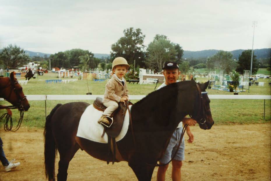 Corey Legge in his childhood riding a horse around the trotter tracks at the Bega Show. Picture supplied. 