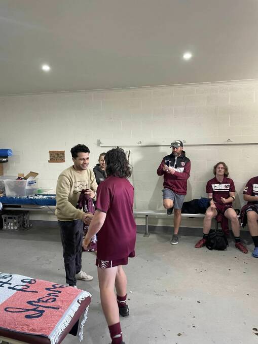 Marcus Mundy and Lucinda Thurston hand out the new Indigenous jerseys to the Tathra Rugby League Juniors club's under 14 and under 16 players. Picture supplied. 