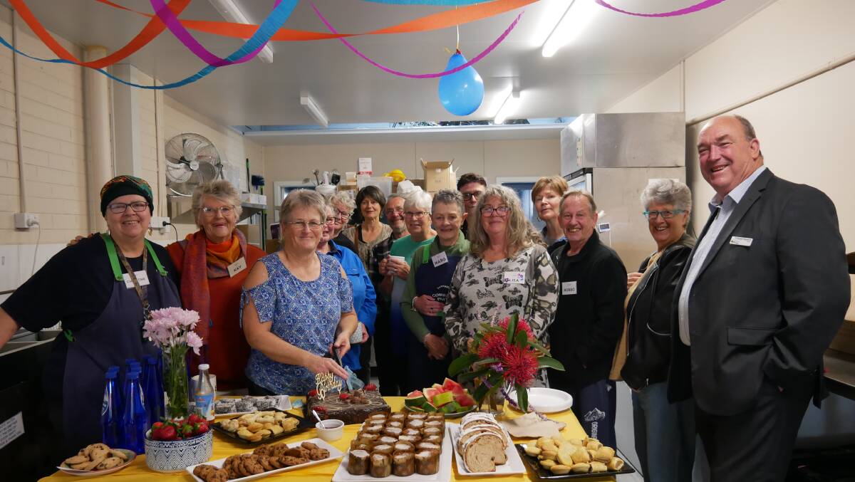 Sapphire Community Pantry president Christine Welsh (far left) and Mayor Russell Fitzpatrick (far right) with pantry volunteers during a morning tea celebration event to mark five years of the pantry. Picture by Ellouise Bailey 