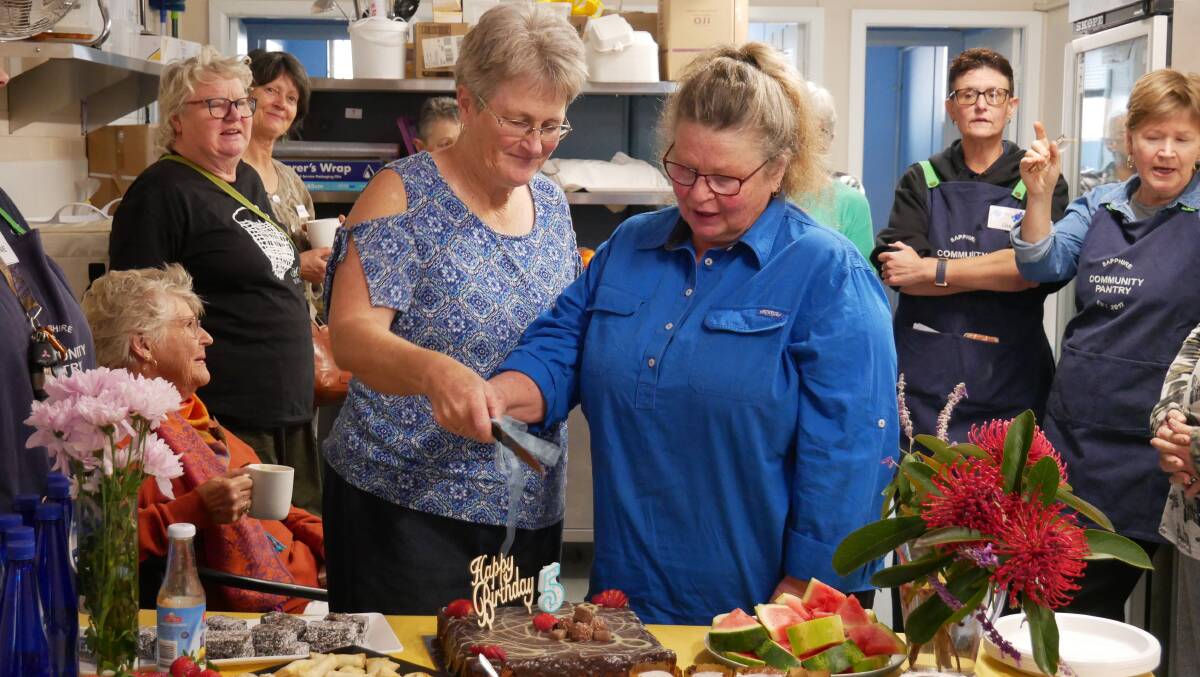 Sapphire Community Pantry volunteers of five years Sue Rootsey and Jenny Foster Crome. Picture by Ellouise Bailey 