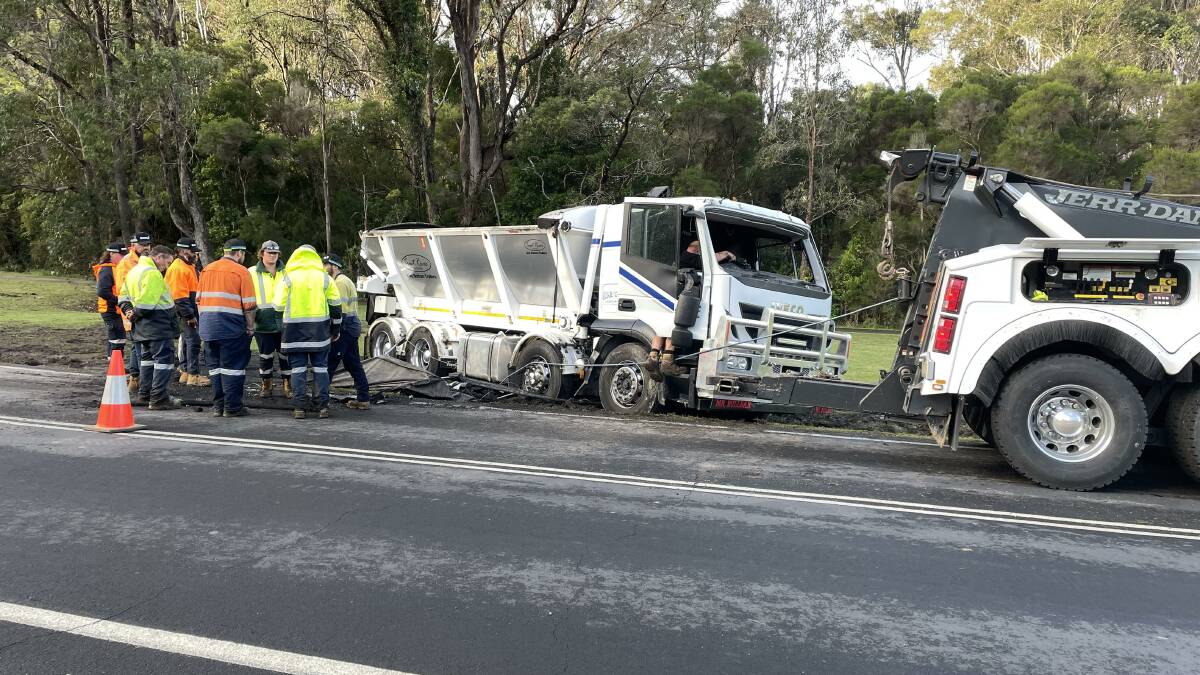 The ambulance service was called to the scene at Wallaga Lake Road, near Haywards Beach, after a large truck rolled over around 9.30am. Picture by Marion Williams