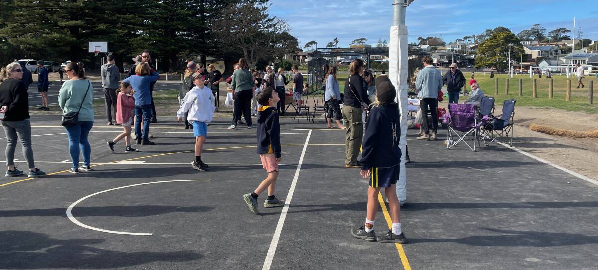 Within minutes of the ribbon being cut, Bermagui's youngsters were trying out the new netball and basketball courts. Picture by Marion Williams