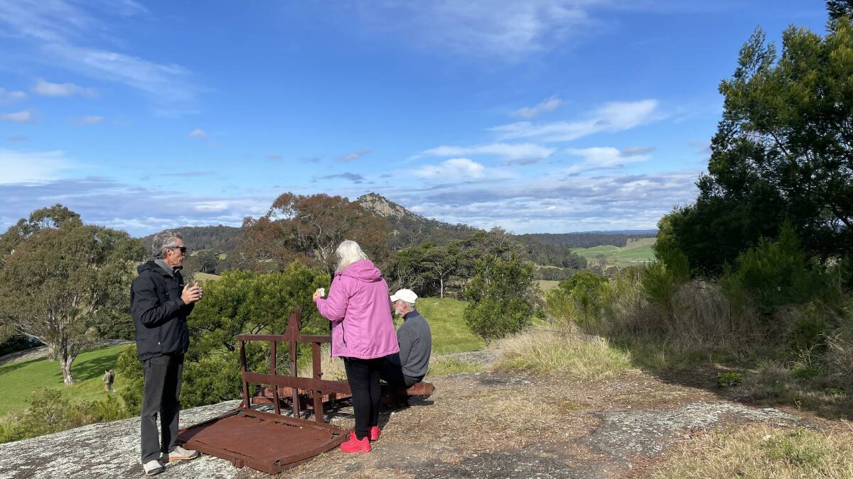 Tilba locals enjoy a break and the view after the community weeding session