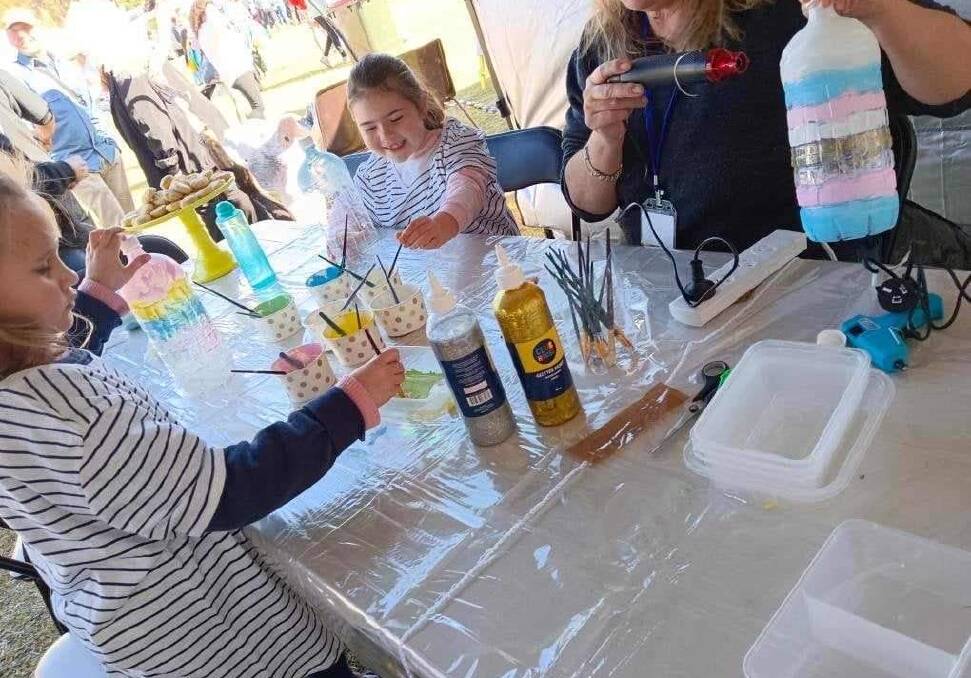 Kids had fun making art from plastic bottles at a workshop at the Mogo Big Day Out. Now there is a Lanterns from Waste competition for 16-26 year-olds to make lanterns from waste as part of the River of Art Festival. Picture supplied