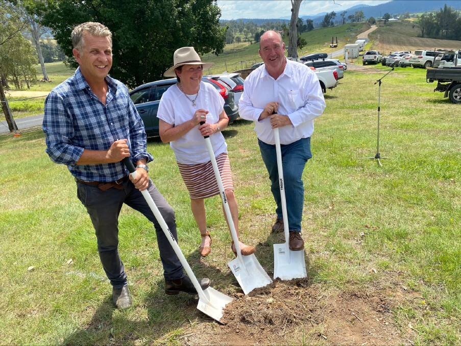 Former MP Andrew Constance, hall committee president June Tarlinton and Mayor Russell Fitzpatrick turned soil to commence the rebuild of the hall in Wandella. Picture supplied Grant Robertson