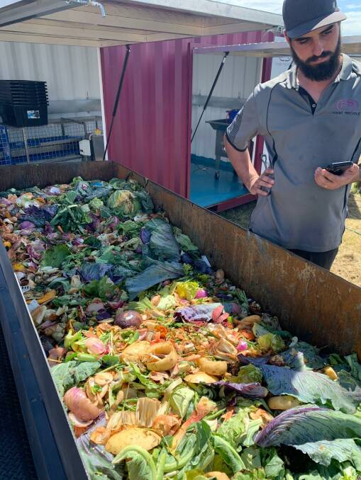 Nathan Boyle with a load of fruit and vegetables collected from the Sydney fish markets. Picture supplied