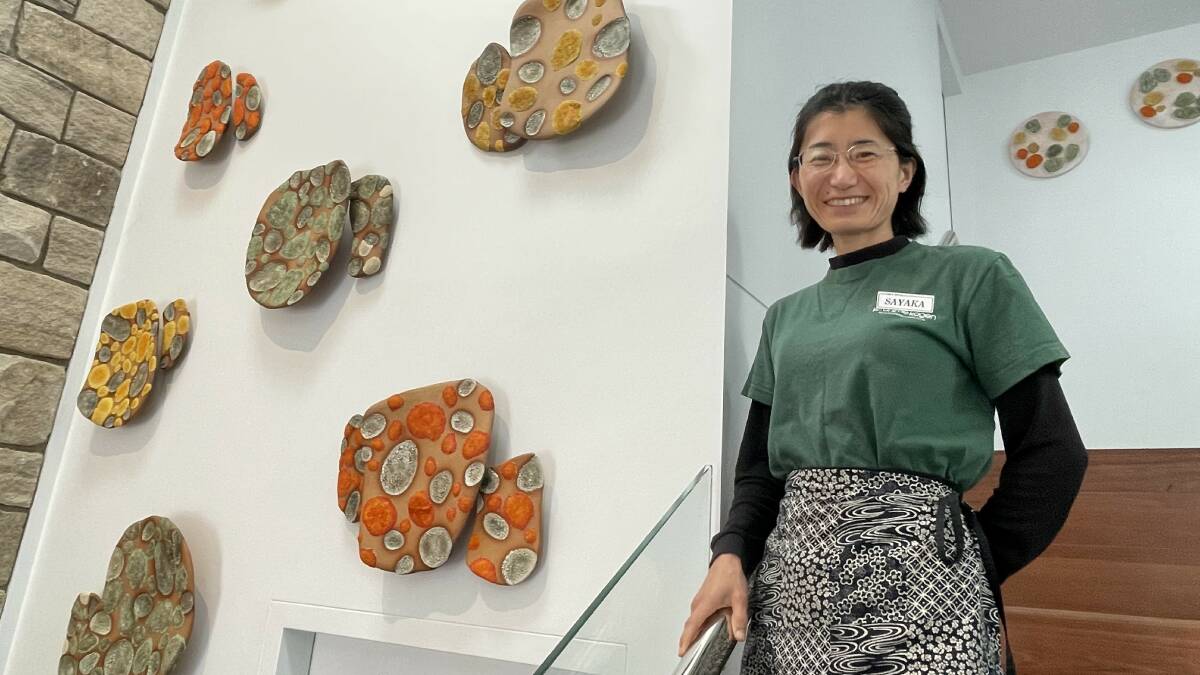 Sayaka Mihara, Tathra Hotel co-owner, stands alongside the Sharon Stevens ceramic installation. Picture by James Parker