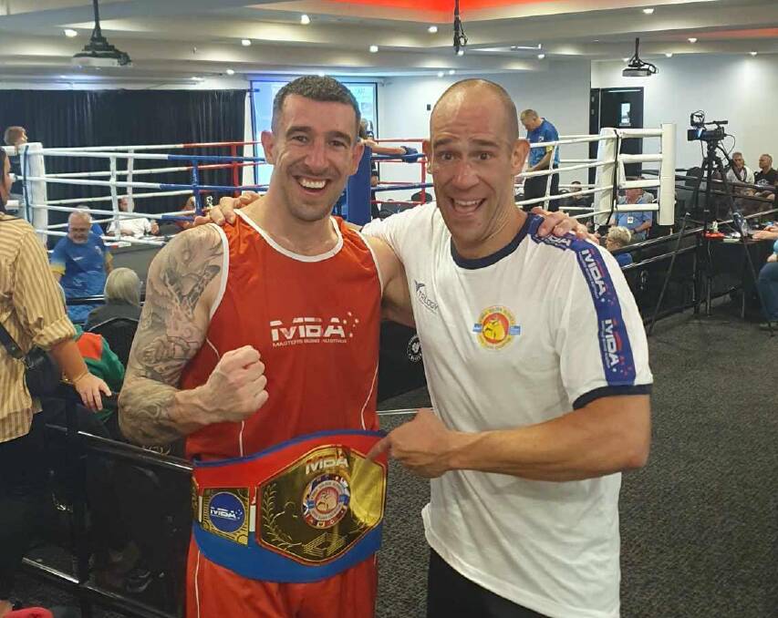 Michael Sinclair with his opponent Flippo Gelada. Picture supplied