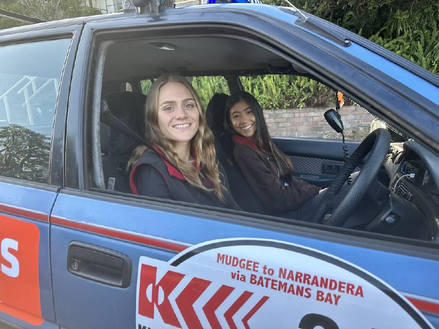 Sam Orchard and Shaniqua Salis in their car 'Short Fuse,' which is covered in the decals and logos from some of their sponsors. Picture supplied