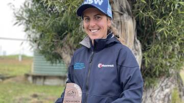 Farann Bussa - decked out in blue with her nationals title trophy. Picture by Vic Silk