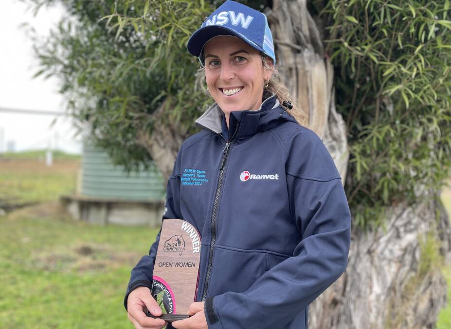 Farann Bussa - decked out in blue with her nationals title trophy. Picture by Vic Silk