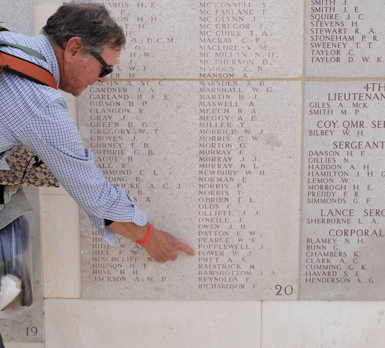 Bermagui resident Stephen Mills points out Pvt Power's name on the Lone Pine Memorial at Gallipoli. Picture supplied