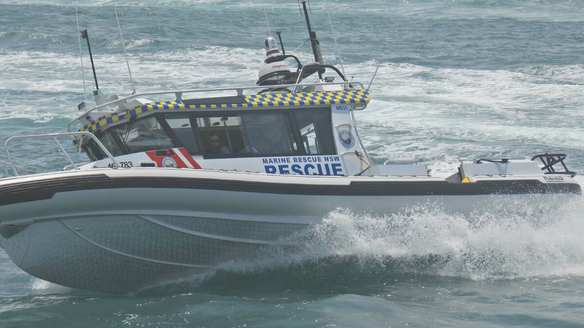 Four people winched to safety after boat capsizes near Tathra