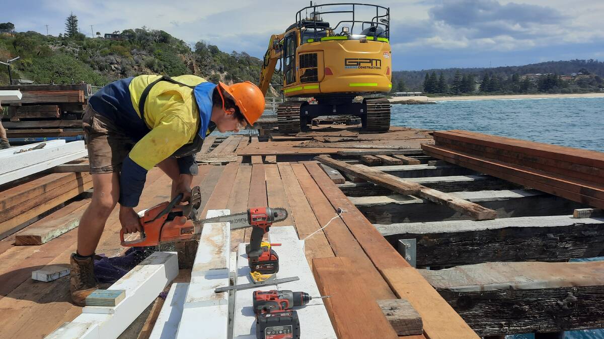 Third-year apprentice bridge carpenter Bill Sutherland embraces the experience of working on the Tathra Wharf restoration project. Picture supplied