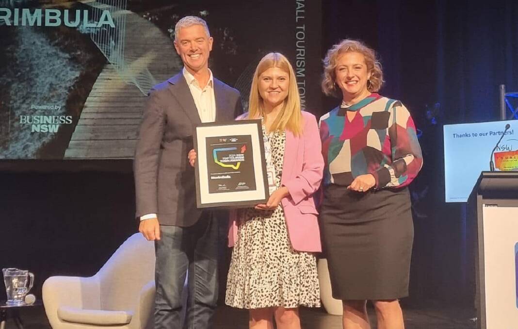 Hanna Marshall from Merimbula Tourism accepts the silver award for Top Tourism Town 2024. Picture supplied