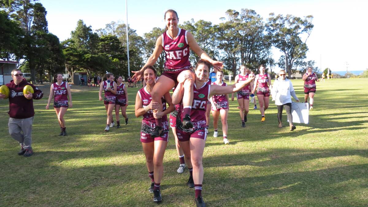 Cymmon Parker is chaired off the ground after marking her 100th game for the Tathra Aussie rules club. Picture by Shirley Rixon