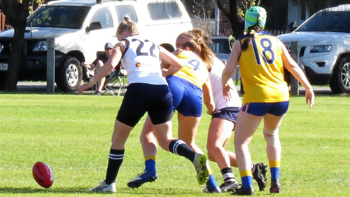 Tathra's Naomi Shoebridge (left) in action during the AFL Masters National Championship. Picture by Shirley Rixon