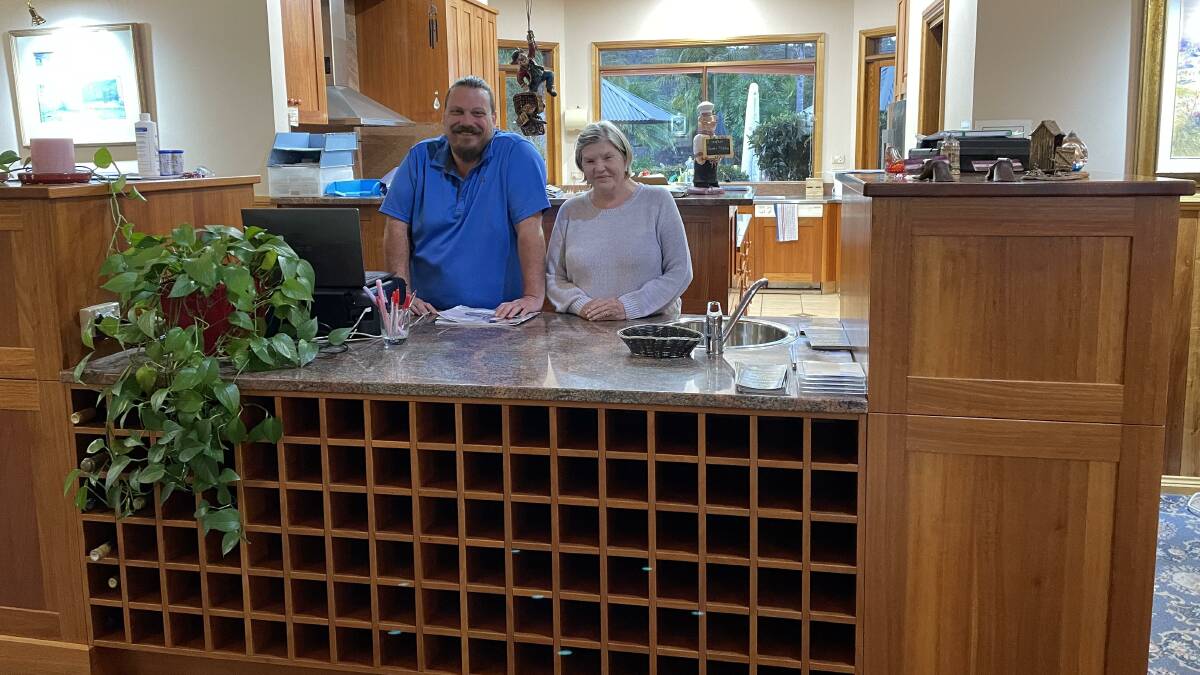 Greg Britten and Robyn Savage at the reception desk made from south east mahogany harvested and milled on site. Picture by Denise Dion