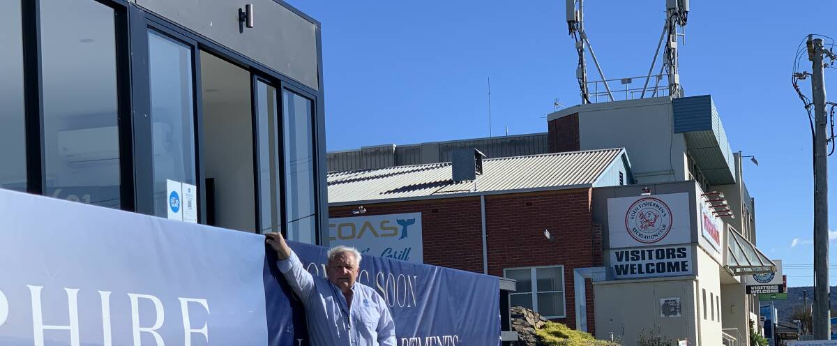 John Palasty, of Virtical at the sales office site, back in 2021 with the Telstra towers in the background prior to the Fishermen's Club's demolition. Photo supplied