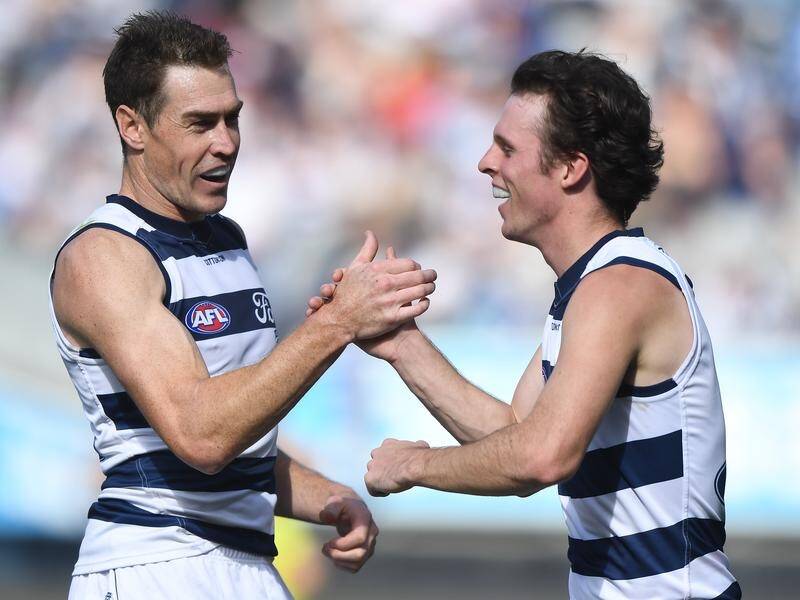 Jeremy Cameron (L) kicked six majors in the undefeated Cats' big win over North Melbourne. (Julian Smith/AAP PHOTOS)