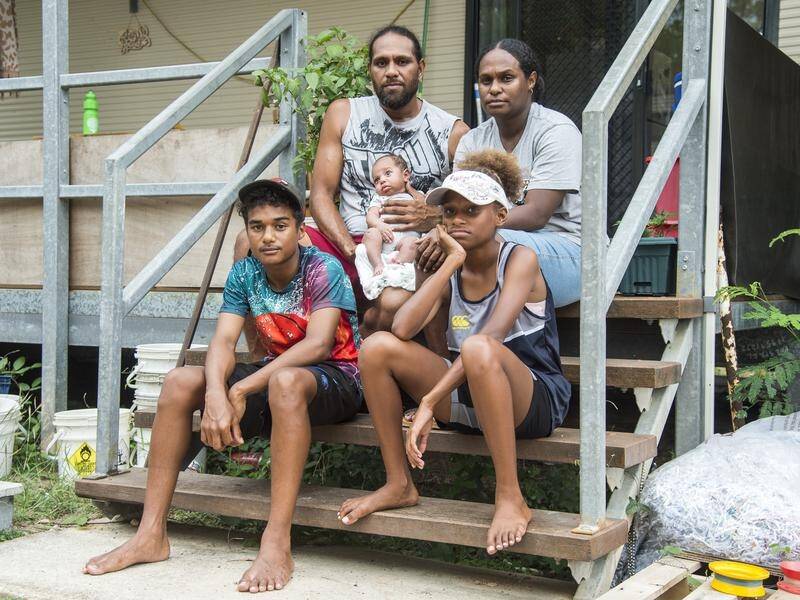 Joseph Passi and partner Ayesha with their children at the donga they rent in the Torres Strait. (AARON BUNCH)